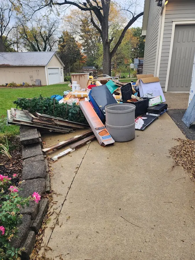 Dumpster being loaded with debris for Roofing Dumpster Rental in Orwigsburg